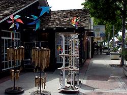 wind chime display on sidewalk