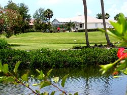 golf behind houses and canal in Apollo Beach