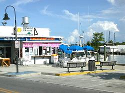 tables, benches, umbrellas at sponge docks