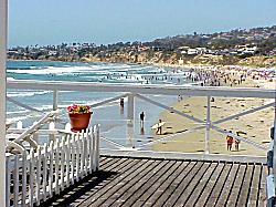 view of the beach from one of the cottages on the pier