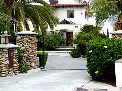 stone entry to Spanish style home