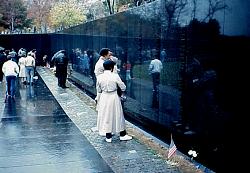families in front of Vietnam Memorial