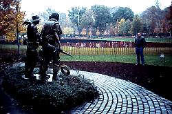 vet in front of memorial