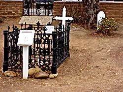 grave near floating spirits