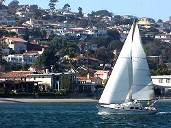 View of San Diego Bay  sailboat with Point Loma in background