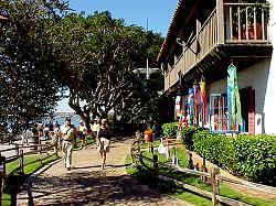 family walking past kite shop